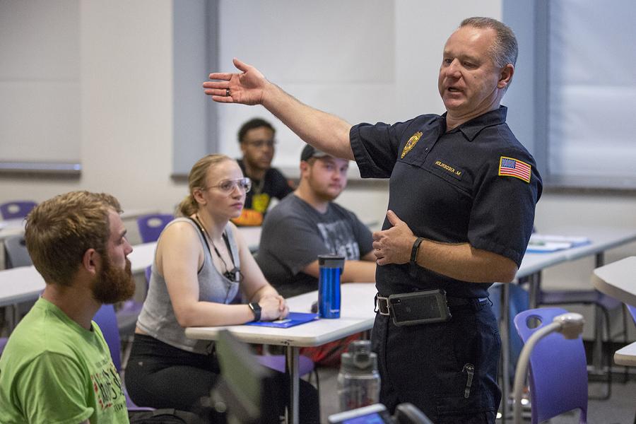 Chief Kiederlin speaks to a class.