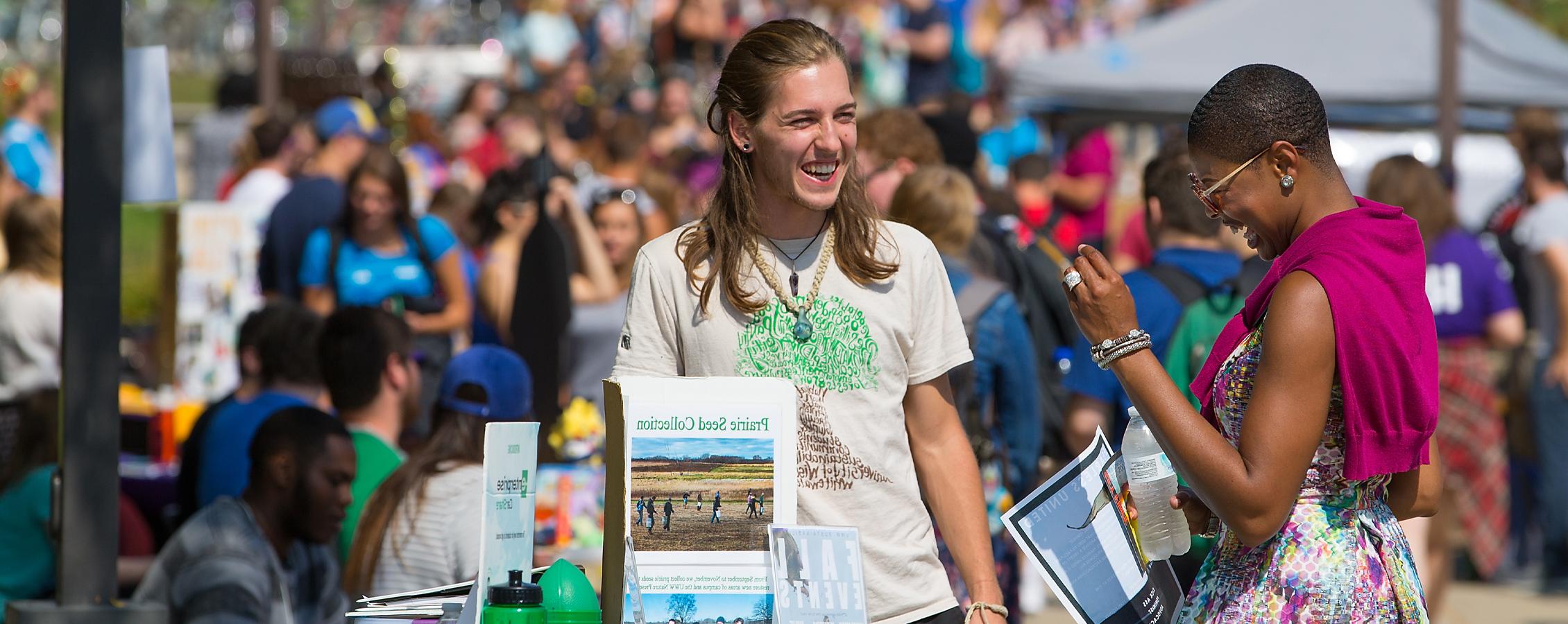 Artanya Wesley laughs with a student.