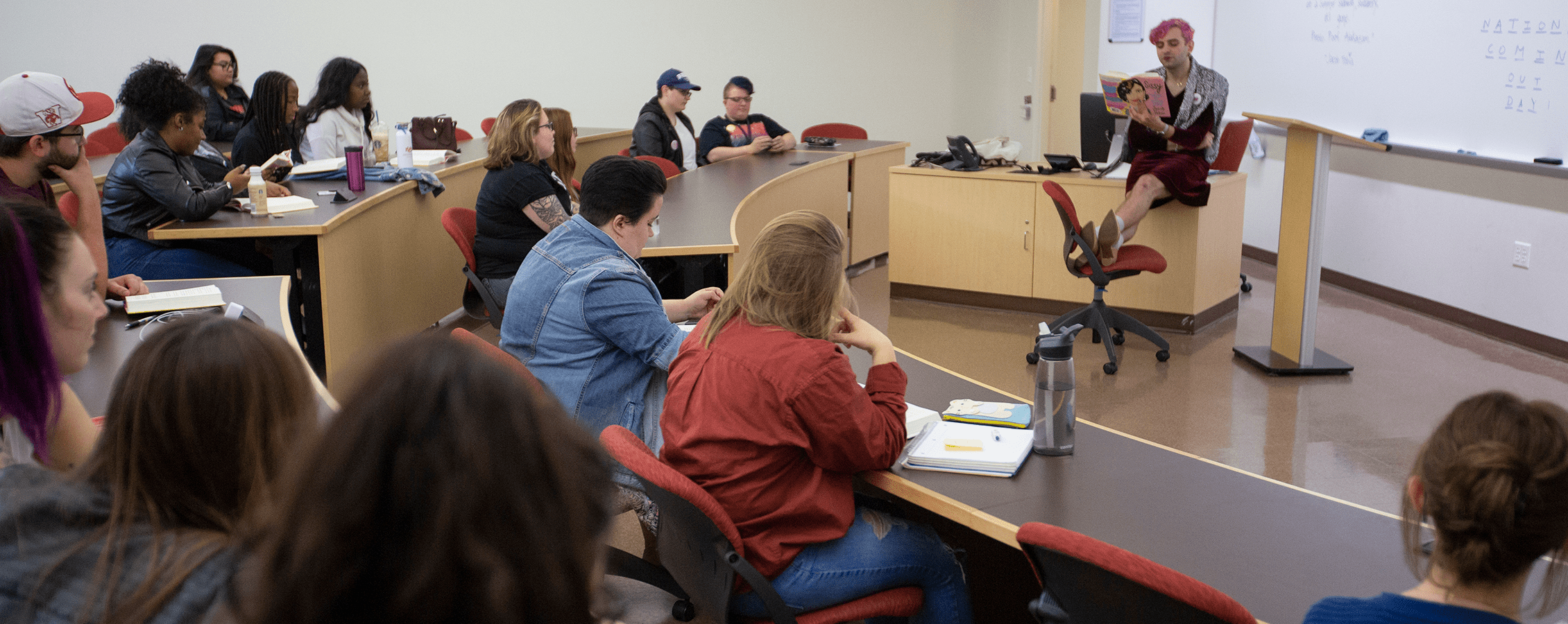 Jacob Tobia reading for the class a book called Queer and Trans Memoir.