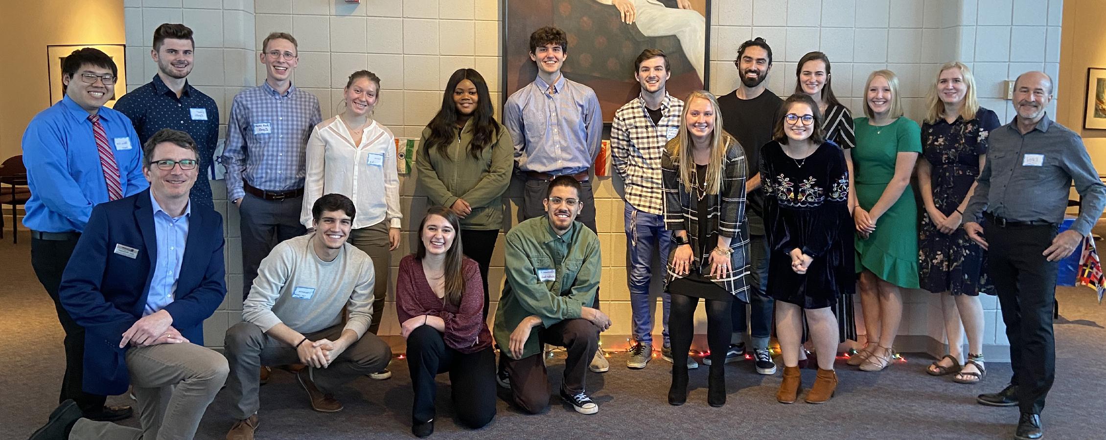 Students and faculty pose for a group photo.